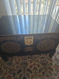 Vintage mid century asian carved trunk on stand with brass latch