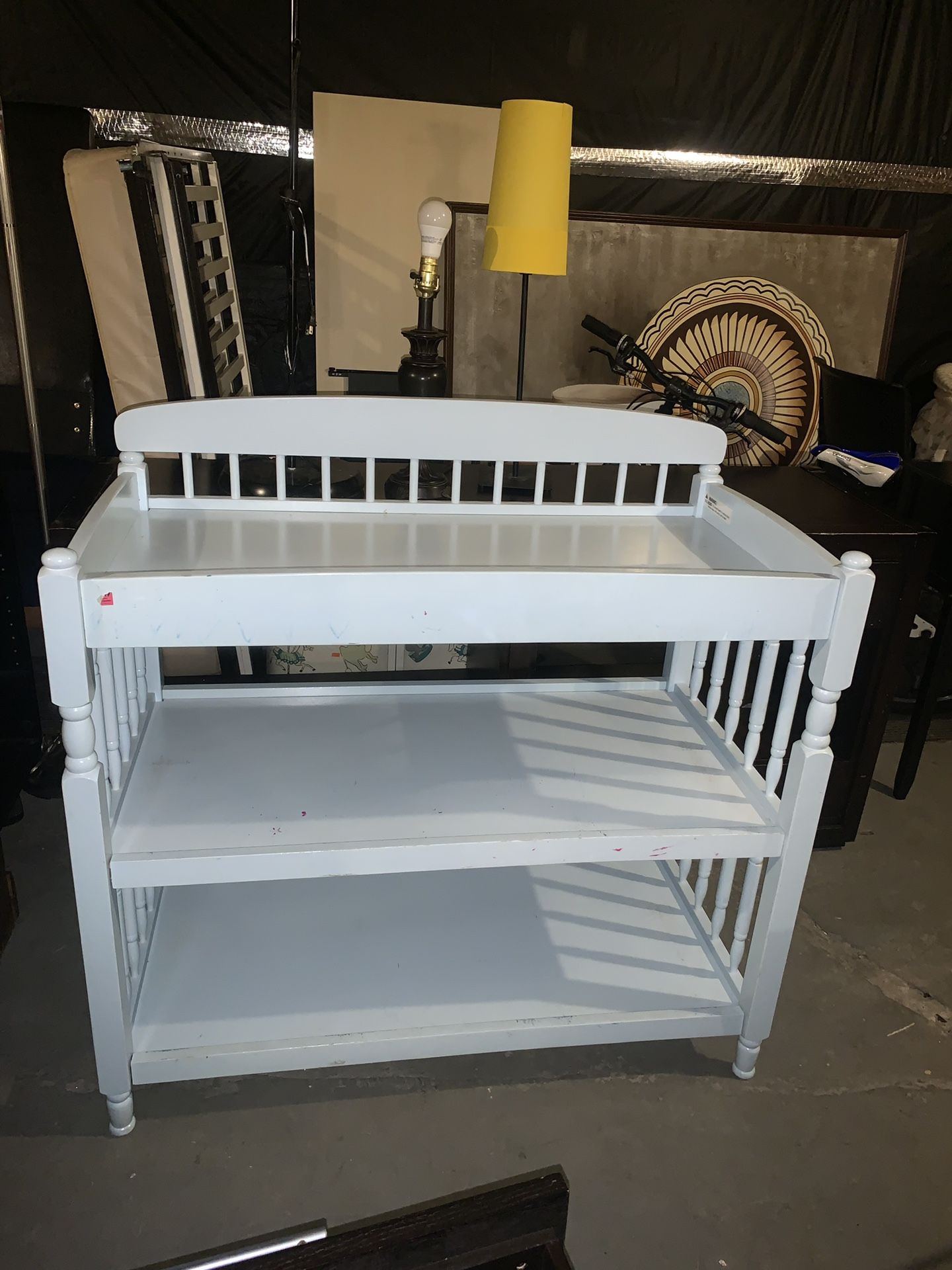 White changing table with storage shelves