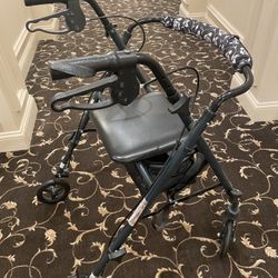 Medline Basic Steel Rollator Walker in black.