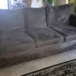 Free XL couch, XL love seat, couches, coffee table, and wall table set.