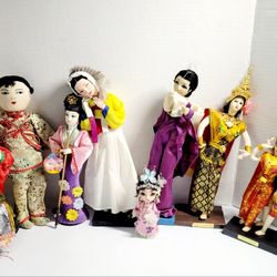 (Lot Of 9) Vintage Collection Of Traditional Dolls From East and Southeast Asia. The image displays a collection of traditional dolls, primarily from 