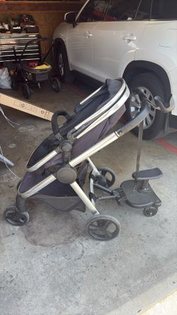 Stroller with toddler seat attachment