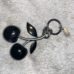 Coach black cherries charm. 