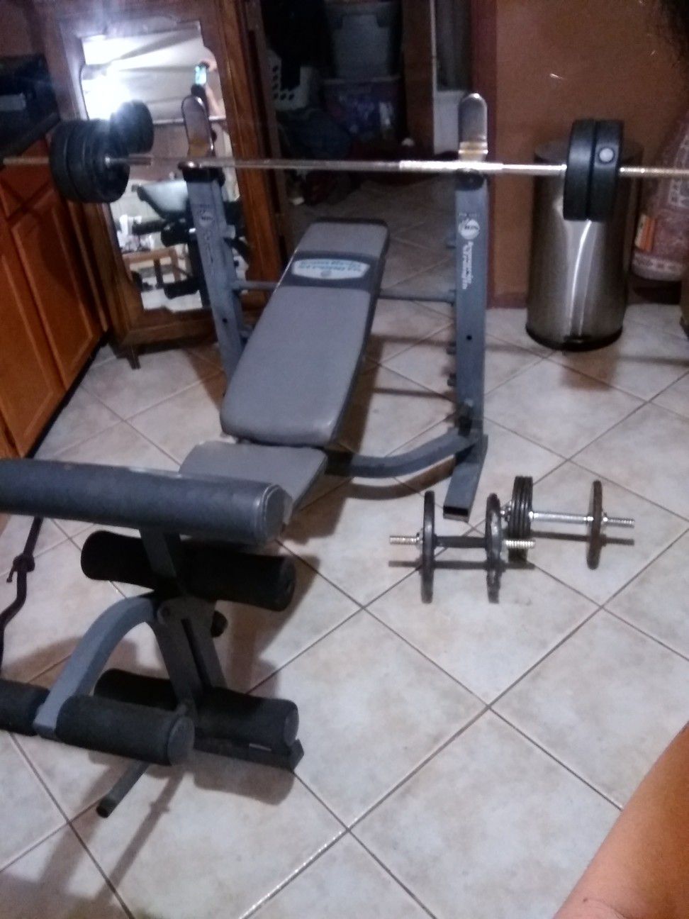 Weight bench with 50 pounds and dumbbells