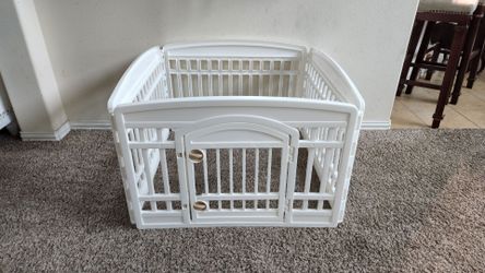 White Indoor/Outdoor 4 Panel Pet Playard with Door for Puppies and Small Dogs. Each panel measures: 33.5"W x 24"H.