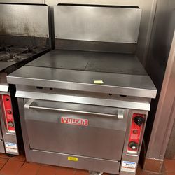 commercial flat top griddle with oven base made by Vulcan.