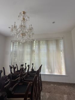 **Elegant Crystal Chandelier**  Beautiful crystal chandelier with a timeless design that adds elegance and sparkle to any dining room or formal living