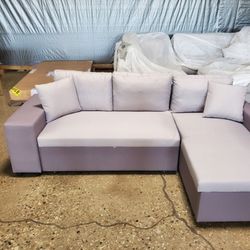 Two tone gray fabric sectional with bed  reversable chaise (New)