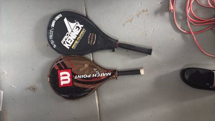 Tennis rackets all with covers great condition no broken strings and a carrying bag with tennis ball holder