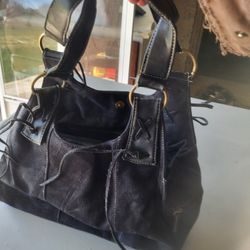Black purse X on strap base