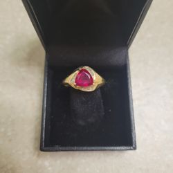 14 K Gold Garnet And Diamonds Ring.  Weight Is 3.5 Grams 