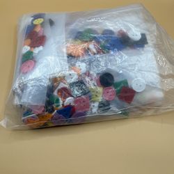Assortment Of Colorful Plastic Buttons In Various Shapes And Sizes