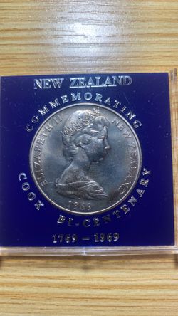 1969 New Zealand One Dollar Commemorative Coin housed in its original dark blue plastic insert display case.
