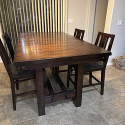 Solid wood dining table pub height high top with 6 chairs