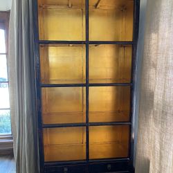 Four Hands - lacquered and golf leaf bookshelves