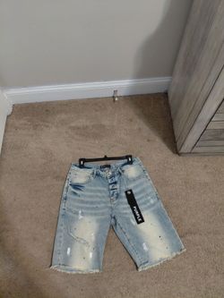 real purple shorts with the tag size 32