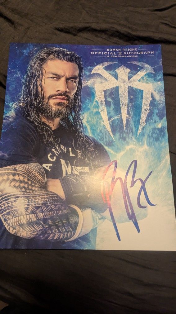 WWE Autographed 11x17 Roman Reigns