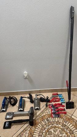 Bundle of professional carpet installation and seaming tools.