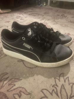 Black and white Puma shoes
