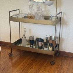 Mid-Century Style Libations Bar Cart in Brass and Glass with Leather Handles and mirror, on wheels