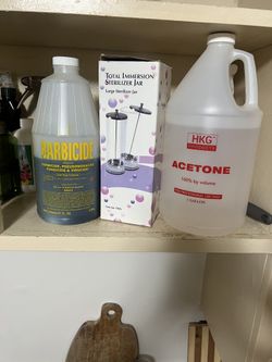 Nail supply’s acetone immersion jar and barbicide