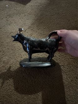 Staffordshire black and gold pottery cow creamer