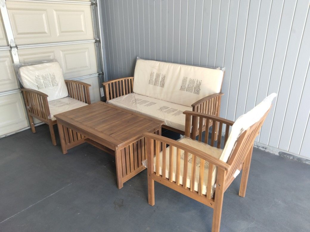 Outdoor patio wood couch with chairs and coffee table
