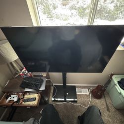 Samsung Smart TV with Adjustable Stand.