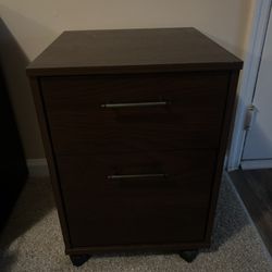 A 2-drawer rolling file cabinet or mobile filing cabinet.