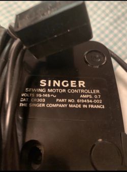 Singer sewing machine with cabinet