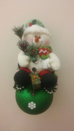 Green hat wearing Snowman Ornament