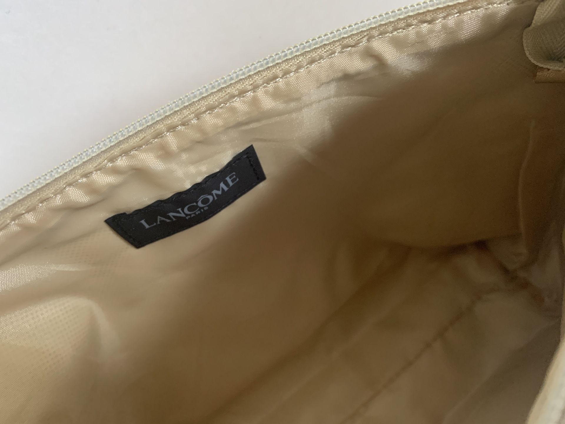 Lancôme Paris gold color gorgeous cosmetic bag. 12”X 6.5”and 2.5”