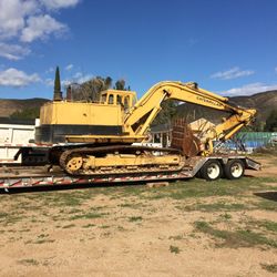 Excavator and backhoe