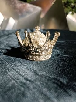 Decorative silver crown-shaped trinket or jewelry box.