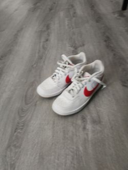 White with red Nike shoes