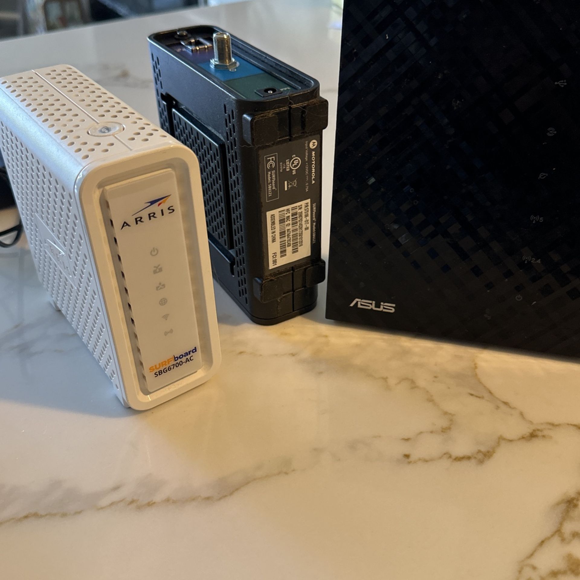 3 Cable Modems, Arris Surfboard, Motorola, and Asus