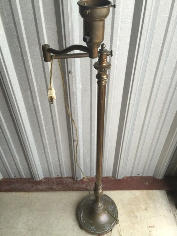 Vintage brass swing arm lamp with wheat decor at base very nice
