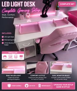 Led light desk with pink gaming chair and 2 pink holders