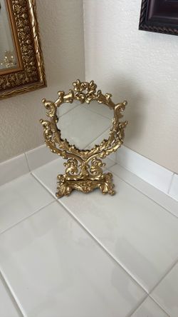 Gilded gold vanity mirror