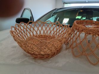 These are vintage-style rose gold or copper-toned decorative wire baskets with a woven lattice design. 

Etsy
 +1
