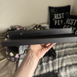 Two black floating shelves for wall