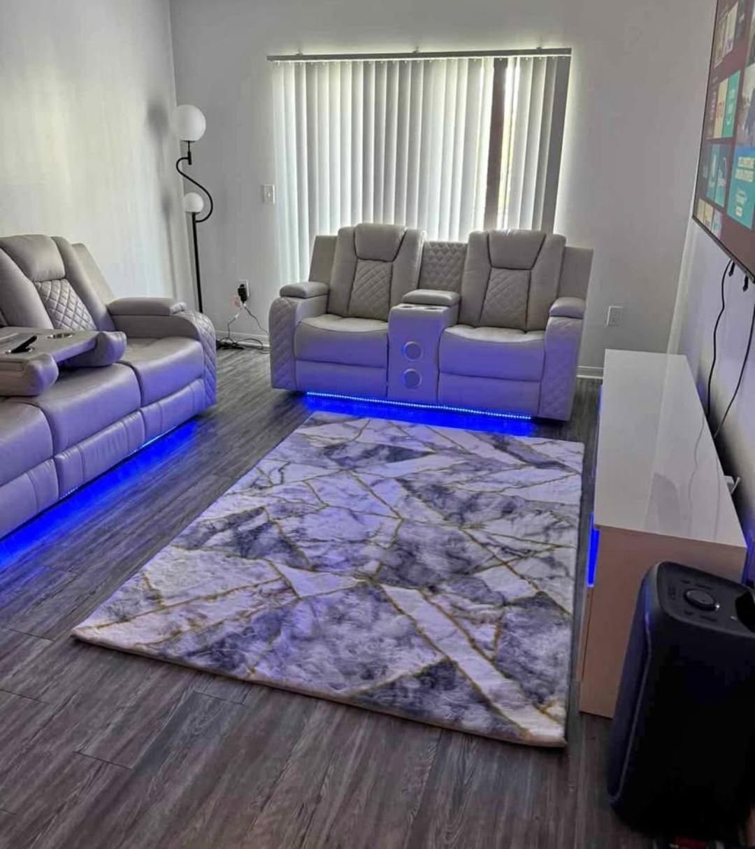 Electric reclining sofa and loveseat