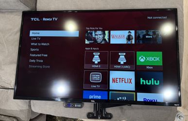 TCL Roku 50 inch smart TV w/ Control and Wall stand