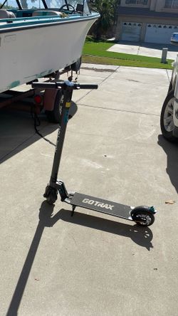 Black and Blue Gotrax E-scooter with Charger