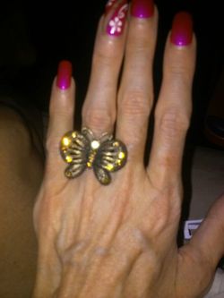Old brass looking butterfly with amber rhinestones!