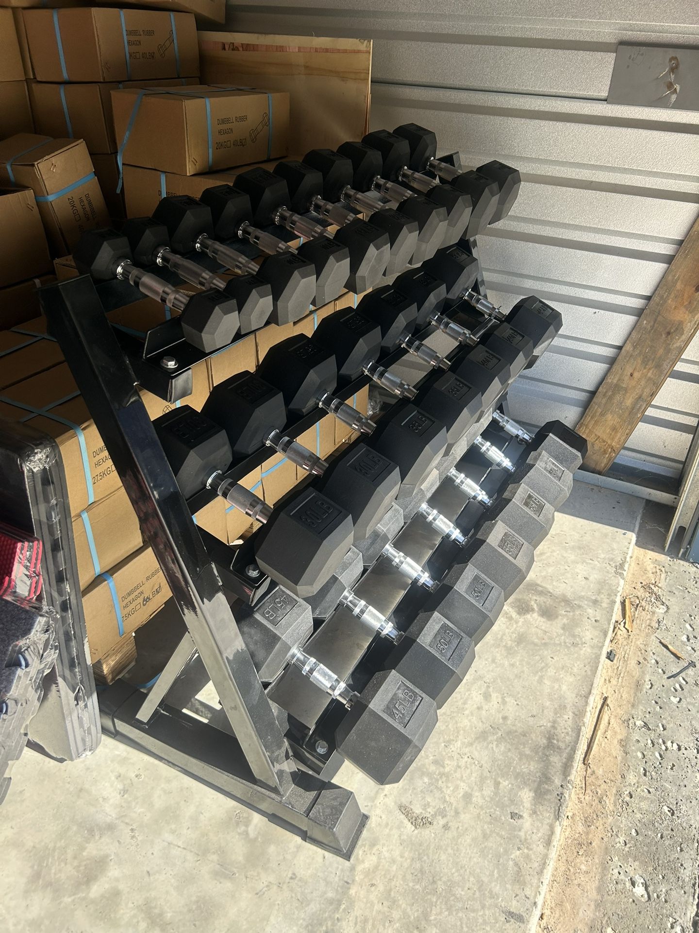 New pair of 5,10,15,20,25,30,35,40,45,50, 55,60lb rubber dumbbells + rack. All new in box $880