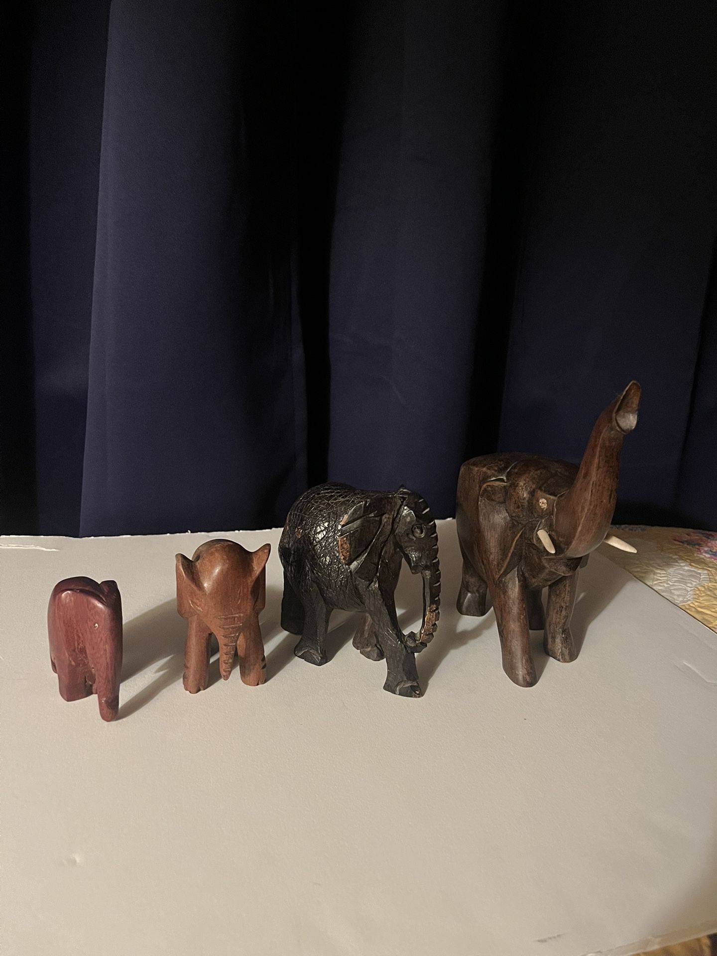 Four Carved Wooden African Elephants