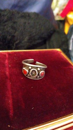 Silver and (corral?) very heavy ring, broken on back n missing a stone