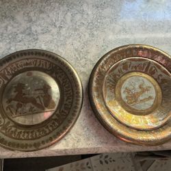 Vintage Egyptian Revival decorative metal wall plates with copper and silver overlay