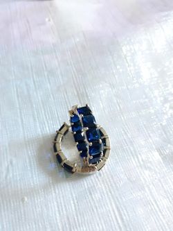 Gold plated hoop earring with blue zirconia stone
